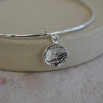 sterling silver small circle cuttlefish charm bangle handmade by Lucy Kemp Jewellery