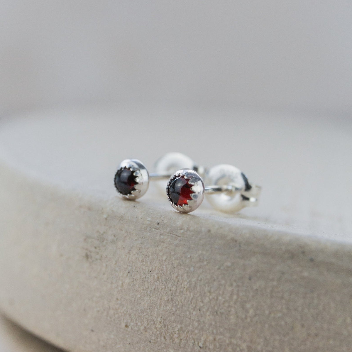 Sterling silver garnet hot sale stud earrings