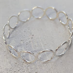 sterling silver handmade circles bangle online exclusive handmade by Lucy Kemp Jewellery comes in a choice of 3 sizes - limited numbers