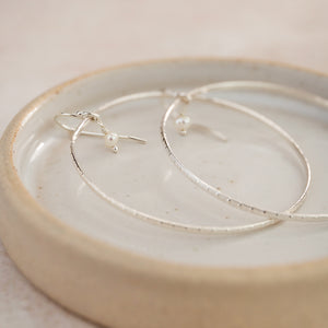 
                  
                    Sterling Silver Celestial Hoop Earrings with Pearls
                  
                