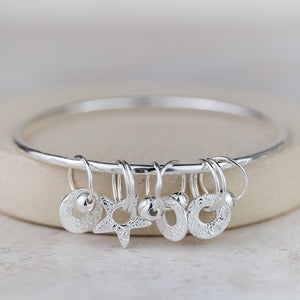 
                  
                    Sterling Silver Charm Bangle
                  
                