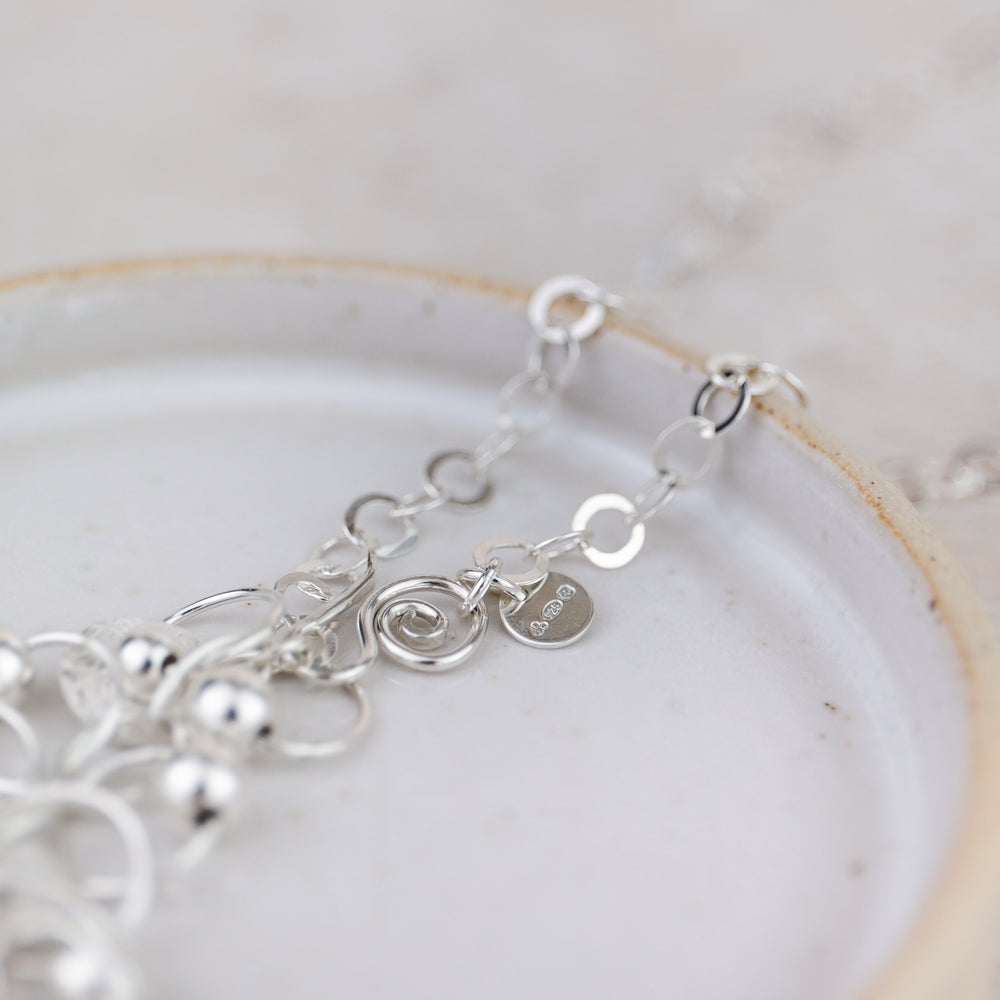 
                  
                    Sterling Silver Charm Necklace
                  
                