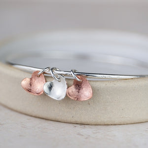 
                  
                    Sterling Silver and Copper Heart Charm Bangle
                  
                