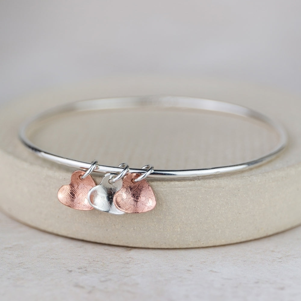 
                  
                    Sterling Silver and Copper Heart Charm Bangle
                  
                