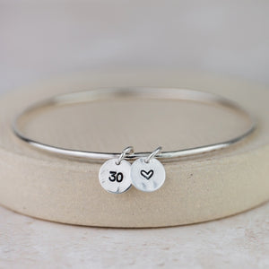 
                  
                    Sterling Silver Dinky Charm Bangle
                  
                