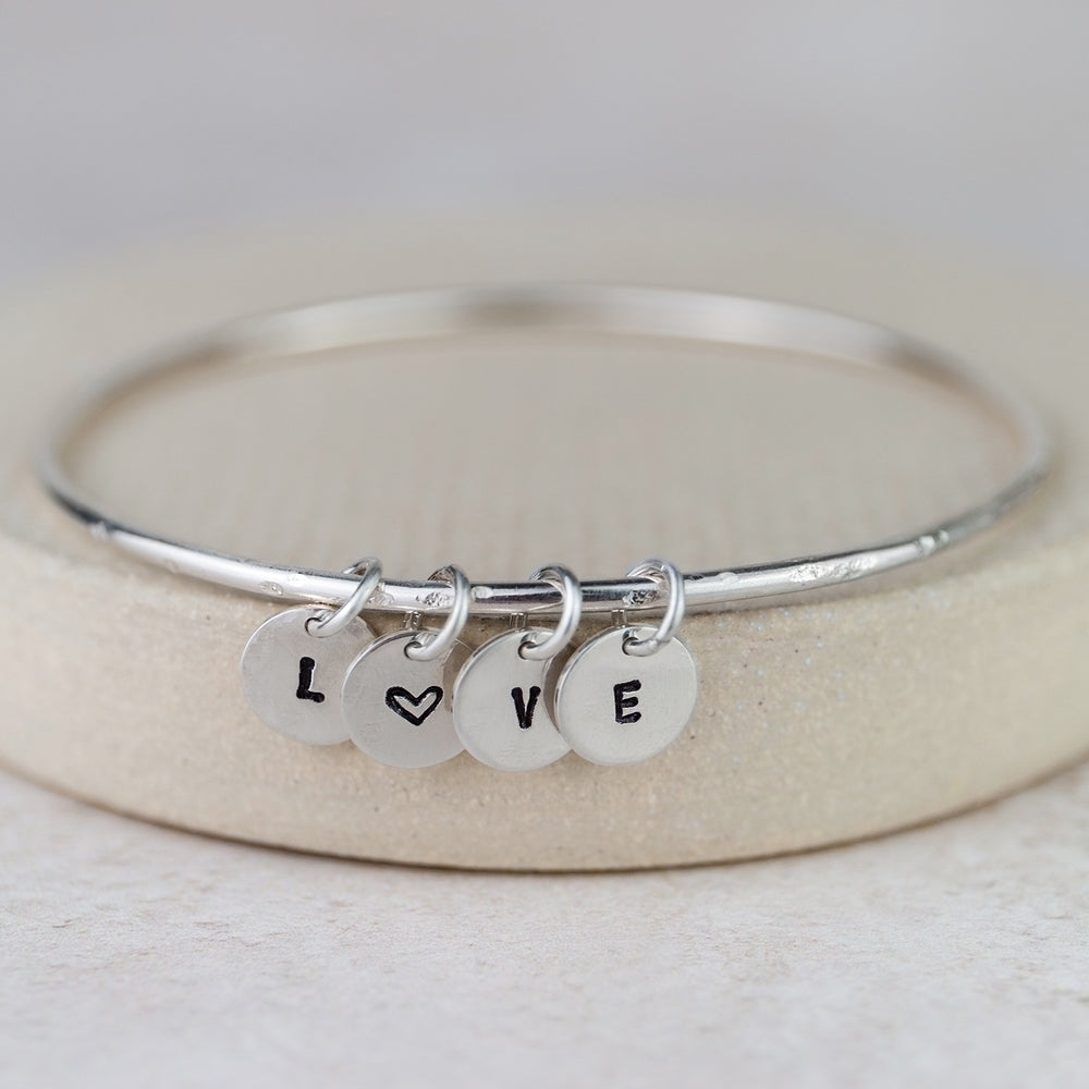 
                  
                    Sterling Silver Dinky Charm Bangle
                  
                
