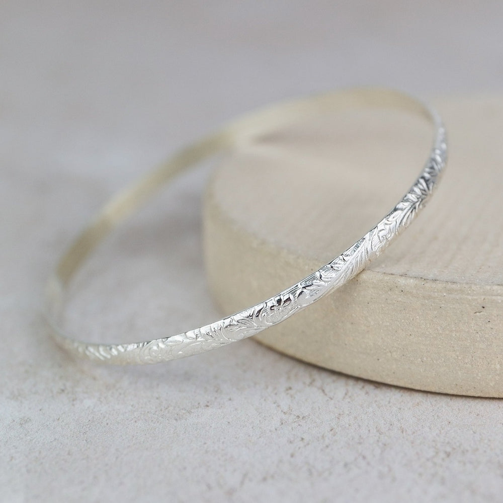 
                  
                    Sterling Silver Floral Textured Bangle
                  
                