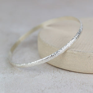 
                  
                    Sterling Silver Floral Textured Bangle
                  
                