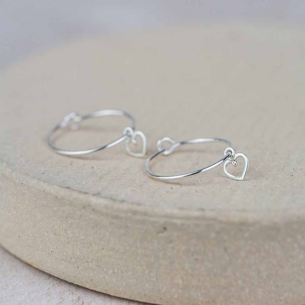 
                  
                    Sterling Silver Charm Hoops with Geo Heart
                  
                