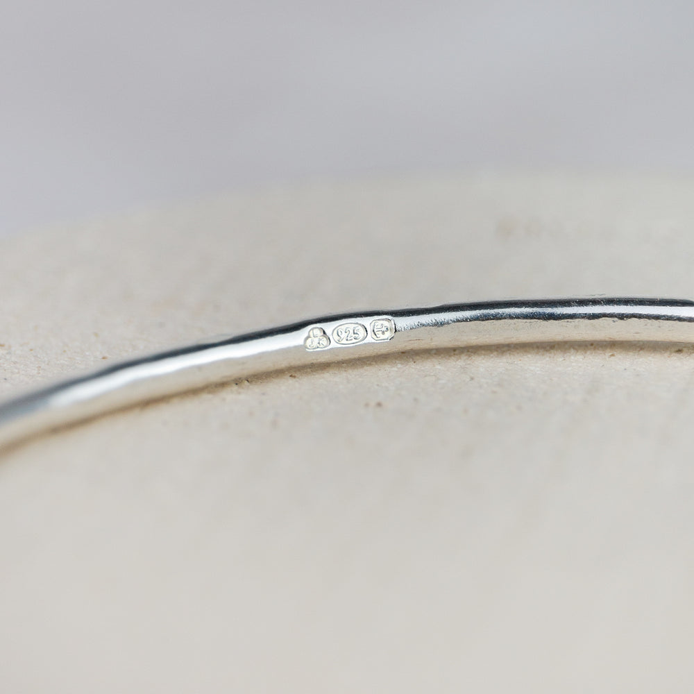 
                  
                    Sterling Silver Textured Tilted Heart Bangle
                  
                