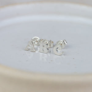 
                  
                    Sterling Silver Initial Studs
                  
                