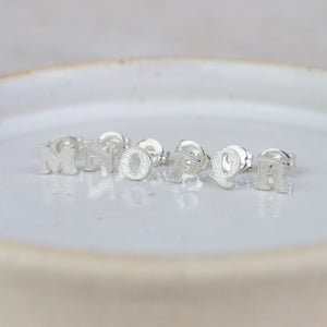 
                  
                    Sterling Silver Initial Studs
                  
                