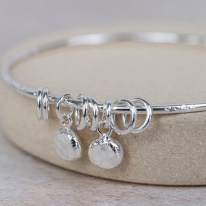 
                  
                    Sterling Silver Nugget Charm Bangle
                  
                
