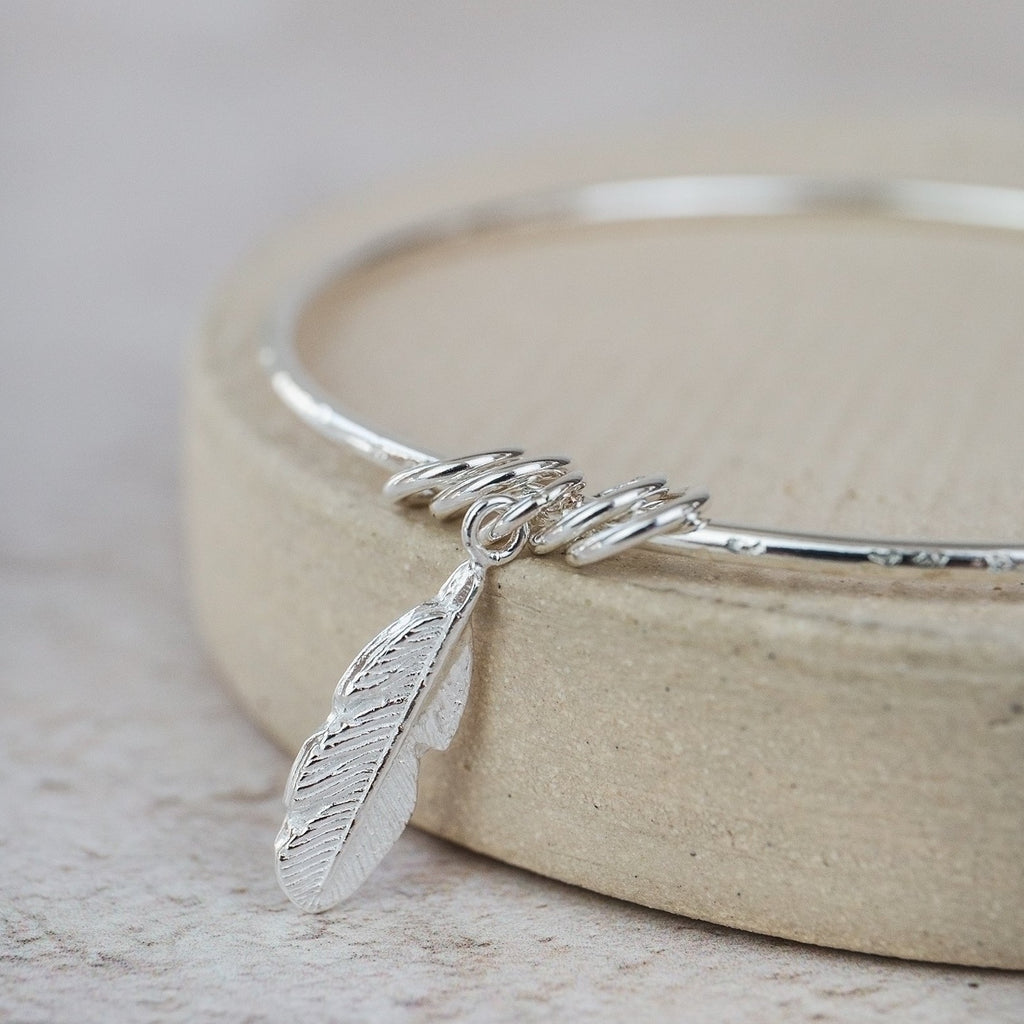 Sterling Silver Feather Charm Bangle – Lucy Kemp Jewellery