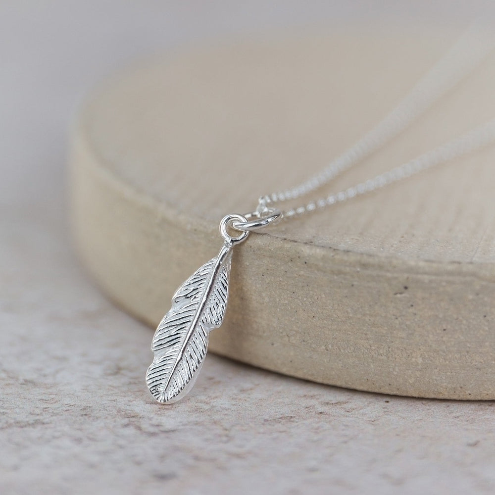 handmade sterling silver small feather pendant by Lucy Kemp Jewellery
