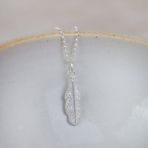 
                  
                    handmade sterling silver small feather pendant by Lucy Kemp Jewellery
                  
                