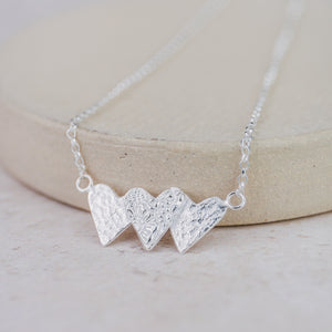 
                  
                    Sterling Silver Triple Heart Necklace
                  
                