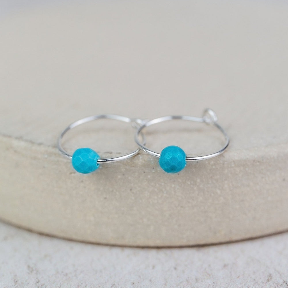 
                  
                    Sterling Silver Charm Hoops with Turquoise Bead
                  
                