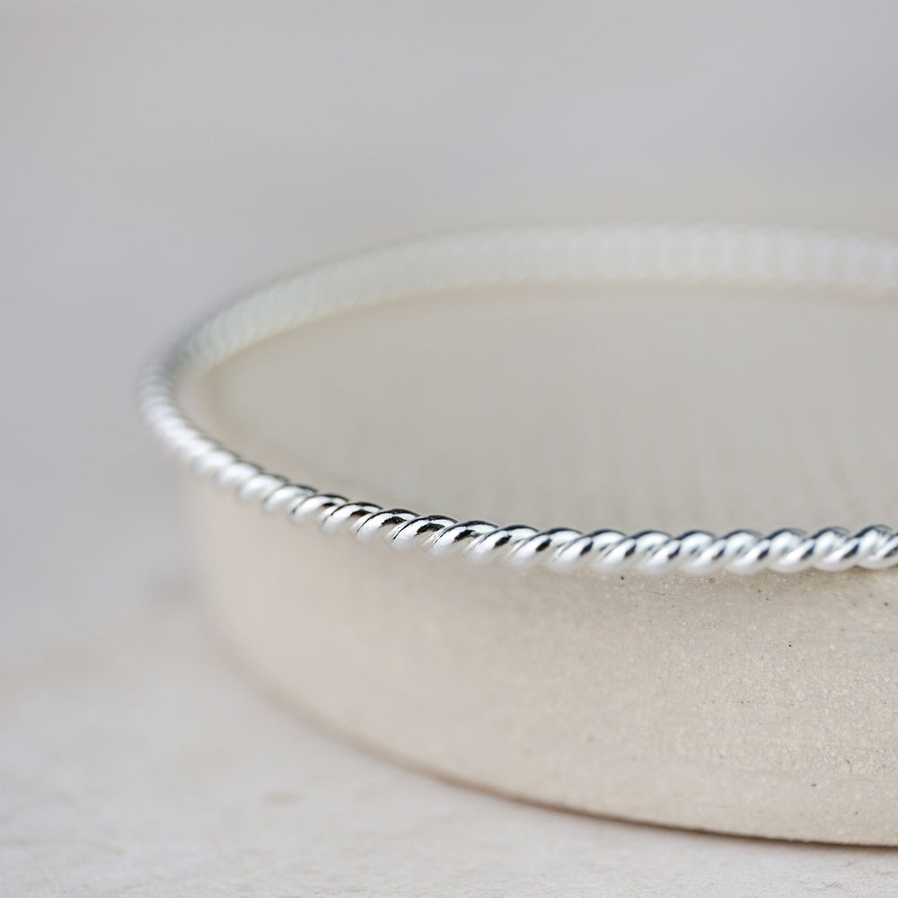 
                  
                    Sterling Silver Twist Bangle
                  
                