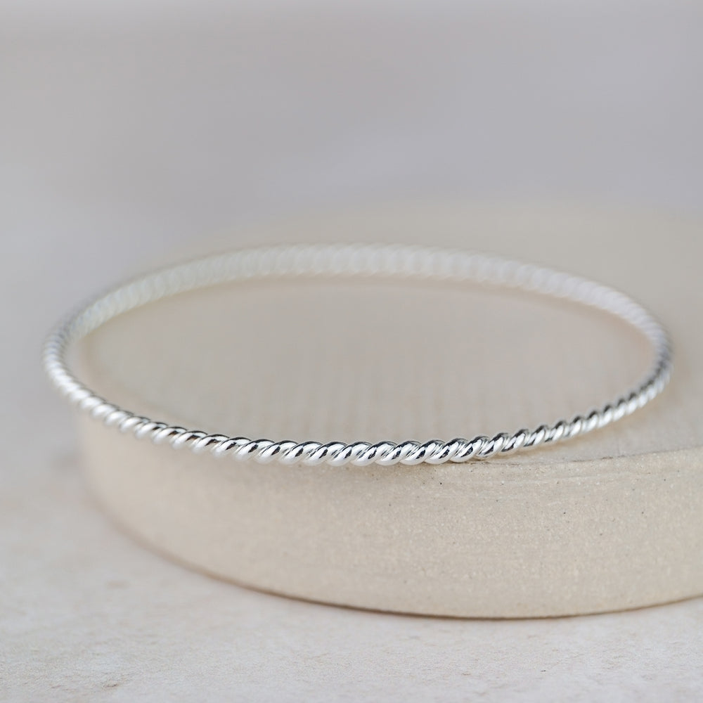 
                  
                    Sterling Silver Twist Bangle
                  
                