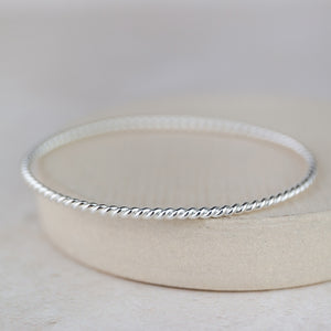 
                  
                    Sterling Silver Twist Bangle
                  
                