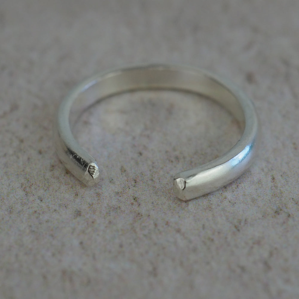 skinny sterling silver hammered toe ring by Lucy Kemp Jewellery