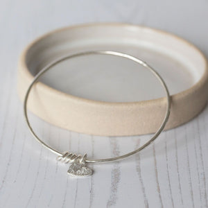 
                  
                    sterling silver textured heart charm bangle handmade by Lucy Kemp Jewellery
                  
                