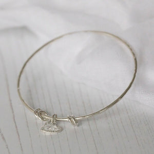 
                  
                    sterling silver textured heart charm bangle handmade by Lucy Kemp Jewellery
                  
                