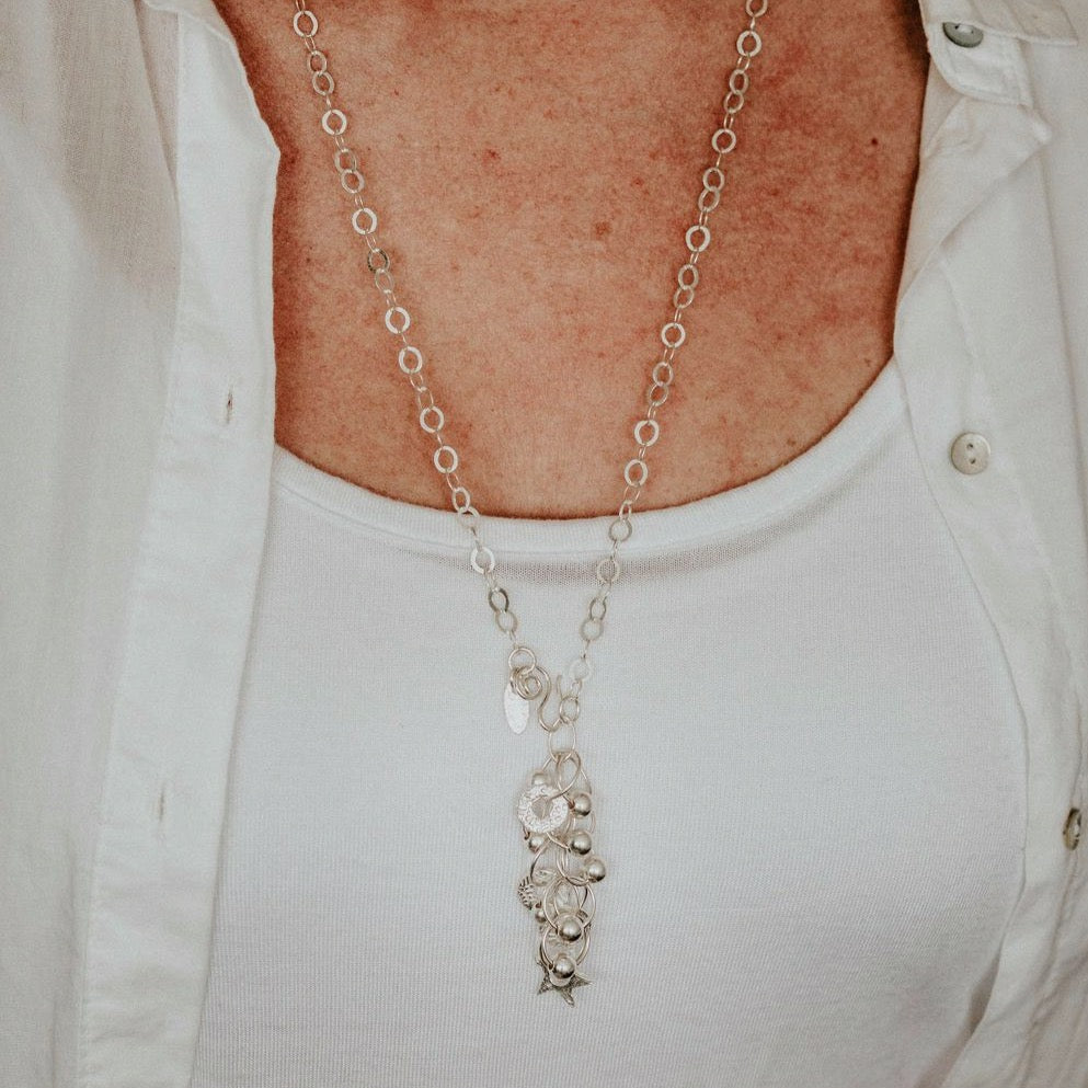 sterling silver charm necklace by Lucy Kemp Jewellery