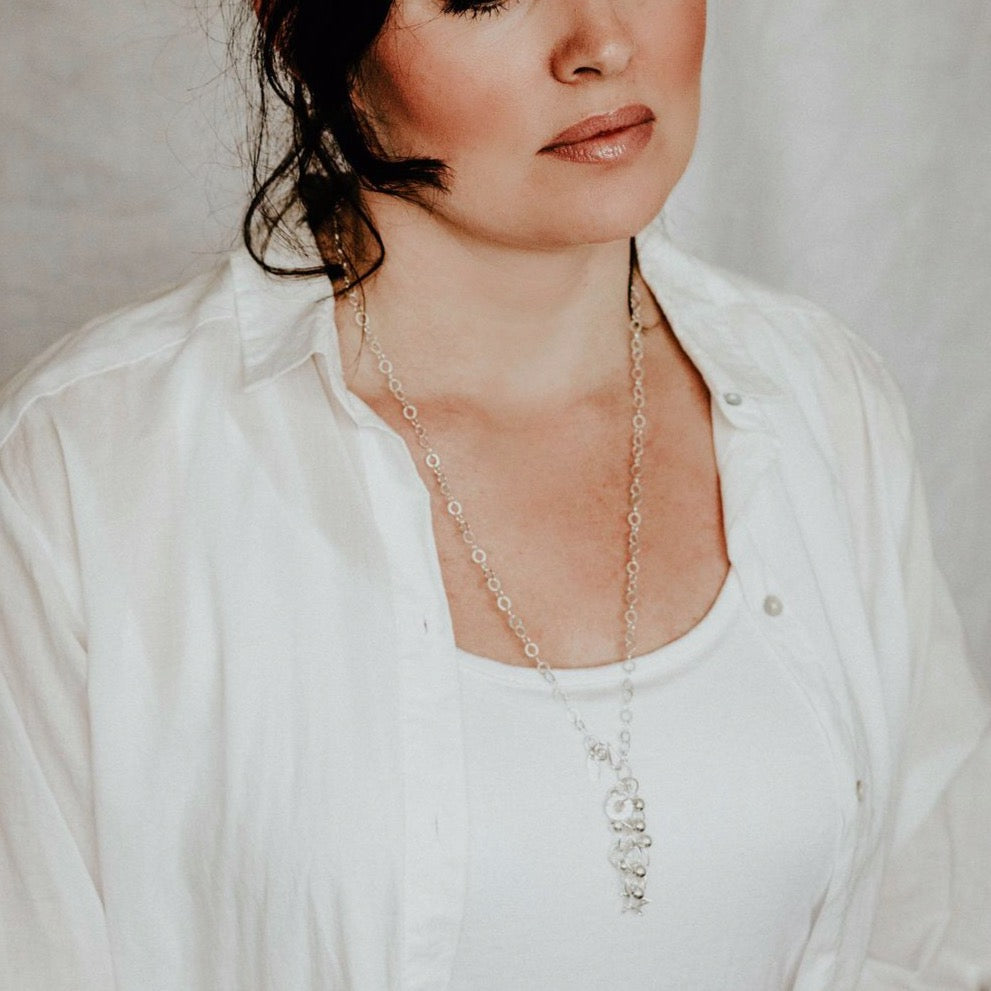 sterling silver charm necklace by Lucy Kemp Jewellery