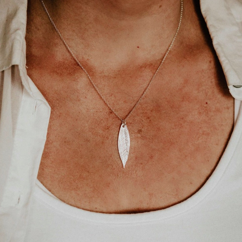 sterling silver textured palm leaf pendant by Lucy Kemp Jewellery worn