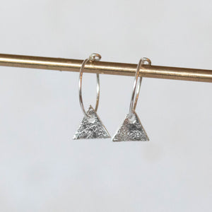 
                  
                    handmade sterling silver textured triangle charm hoops
                  
                