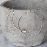 Handmade sterling silver mismatch sun and moon earrings by Lucy Kemp Jewellery 