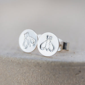 
                  
                    sterling silver and stamped bee studs handmade by Lucy Kemp Jewellery 
                  
                