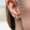 sterling silver lace capsule textured studs worn by Lucy Kemp Jewellery