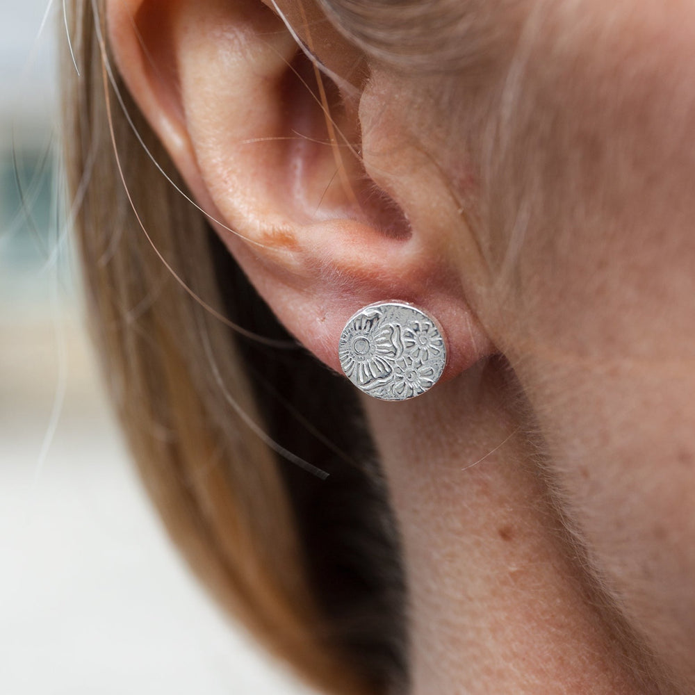 
                  
                    sterling silver textured circle studs worn by Lucy Kemp Jewellery
                  
                