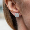 sterling silver textured circle studs worn by Lucy Kemp Jewellery