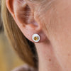 Worn citrine and sterling silver birthstone small disc studs by Lucy Kemp Jewellery
