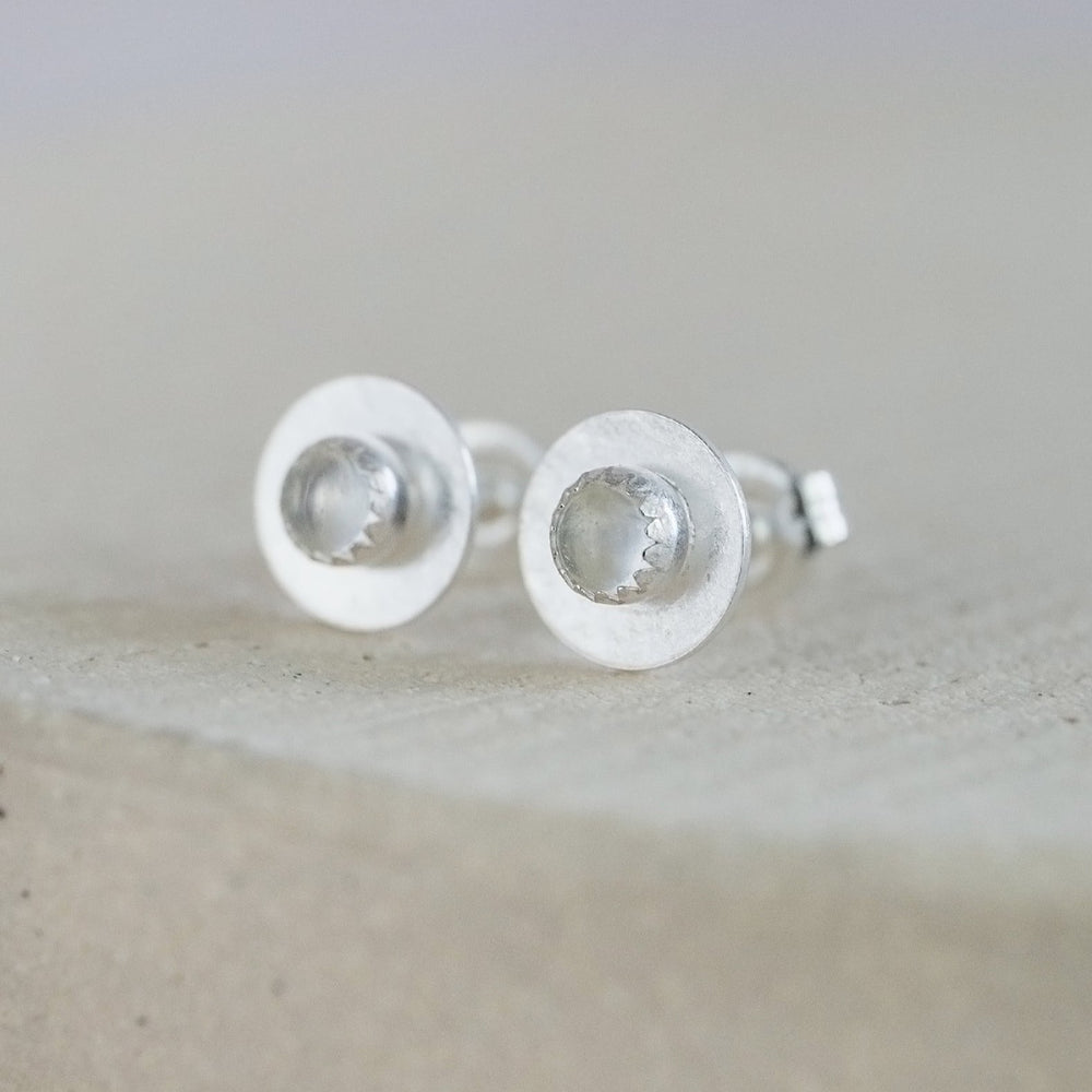 
                  
                    Crystal Quartz and sterling silver birthstone small disc studs by Lucy Kemp Jewellery
                  
                