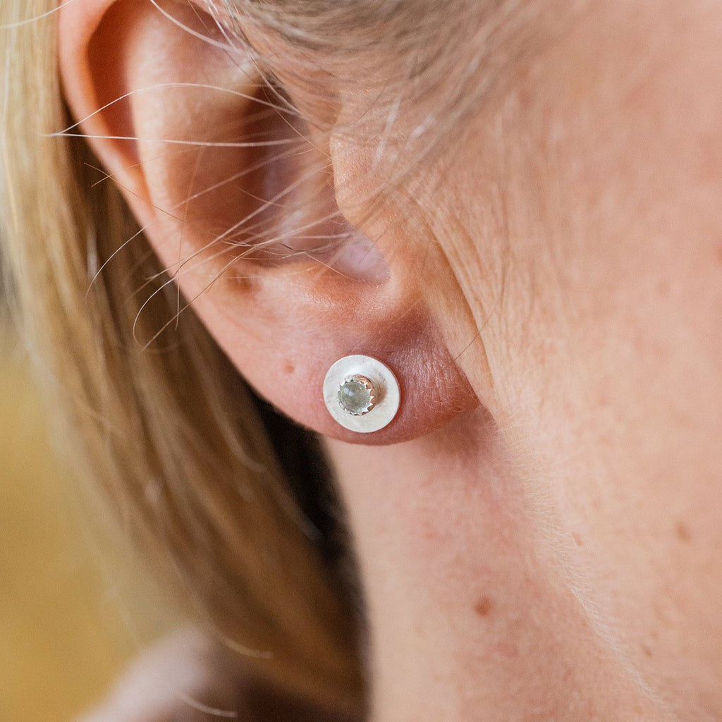 Worn Crystal Quartz and sterling silver birthstone small disc studs by Lucy Kemp Jewellery