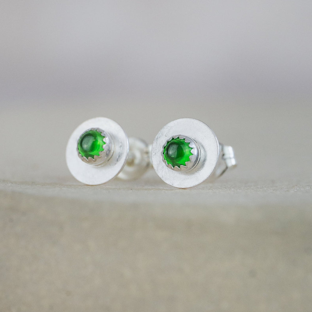 
                  
                    Emerald CZ (SYN)  and sterling silver birthstone small disc studs by Lucy Kemp Jewellery
                  
                