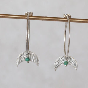 
                  
                    Sterling silver textured moon and turquoise bead hoop earring handmade by Lucy Kemp Jewellery 
                  
                