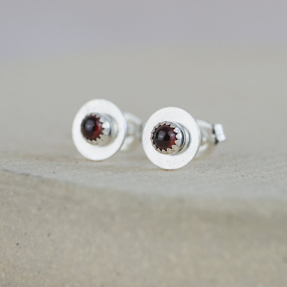 
                  
                    Garnet  and sterling silver birthstone small disc studs by Lucy Kemp Jewellery
                  
                