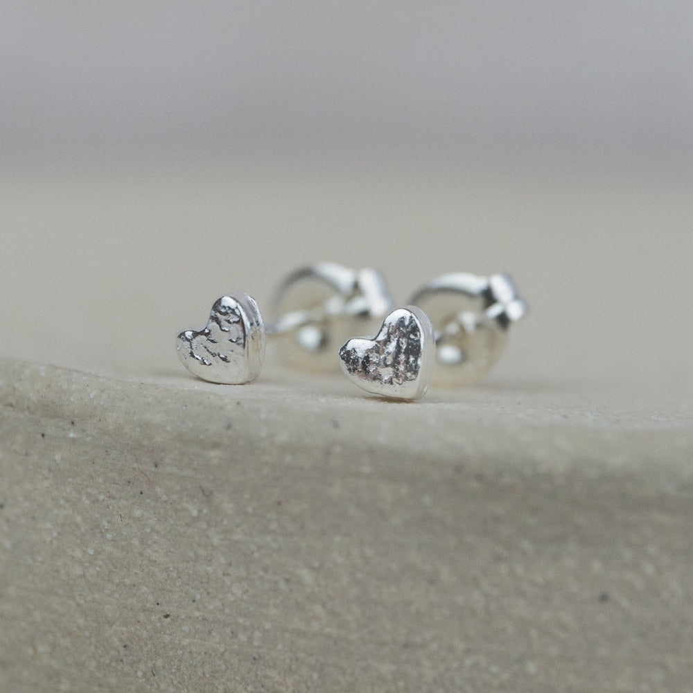 
                  
                    sterling silver textured mini heart studs
                  
                