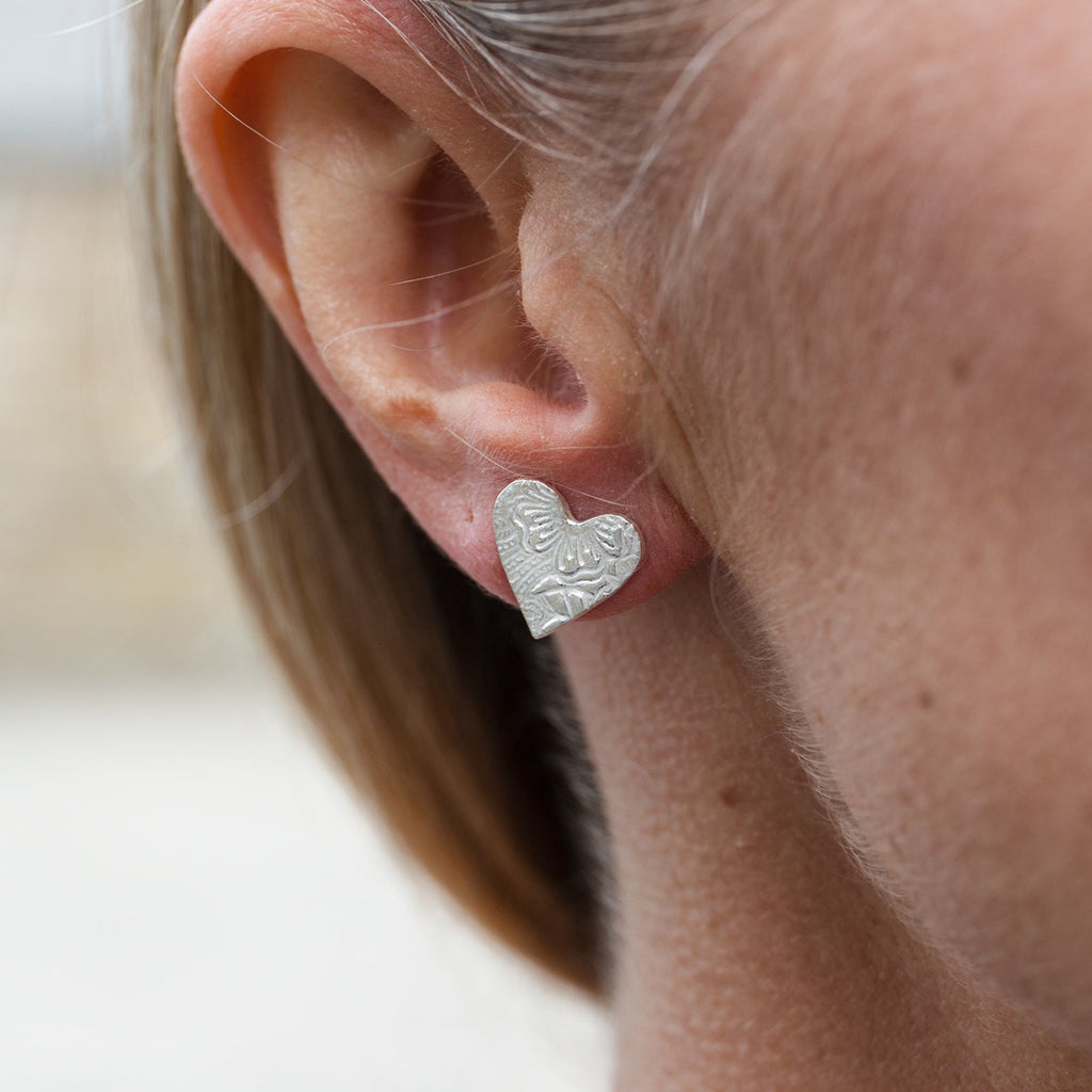 sterling silver textured heart studs worn  by Lucy Kemp Jewellery 