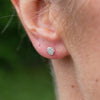 sterling silver min hexagon studs worn, handmade  by Lucy Kemp Jewellery