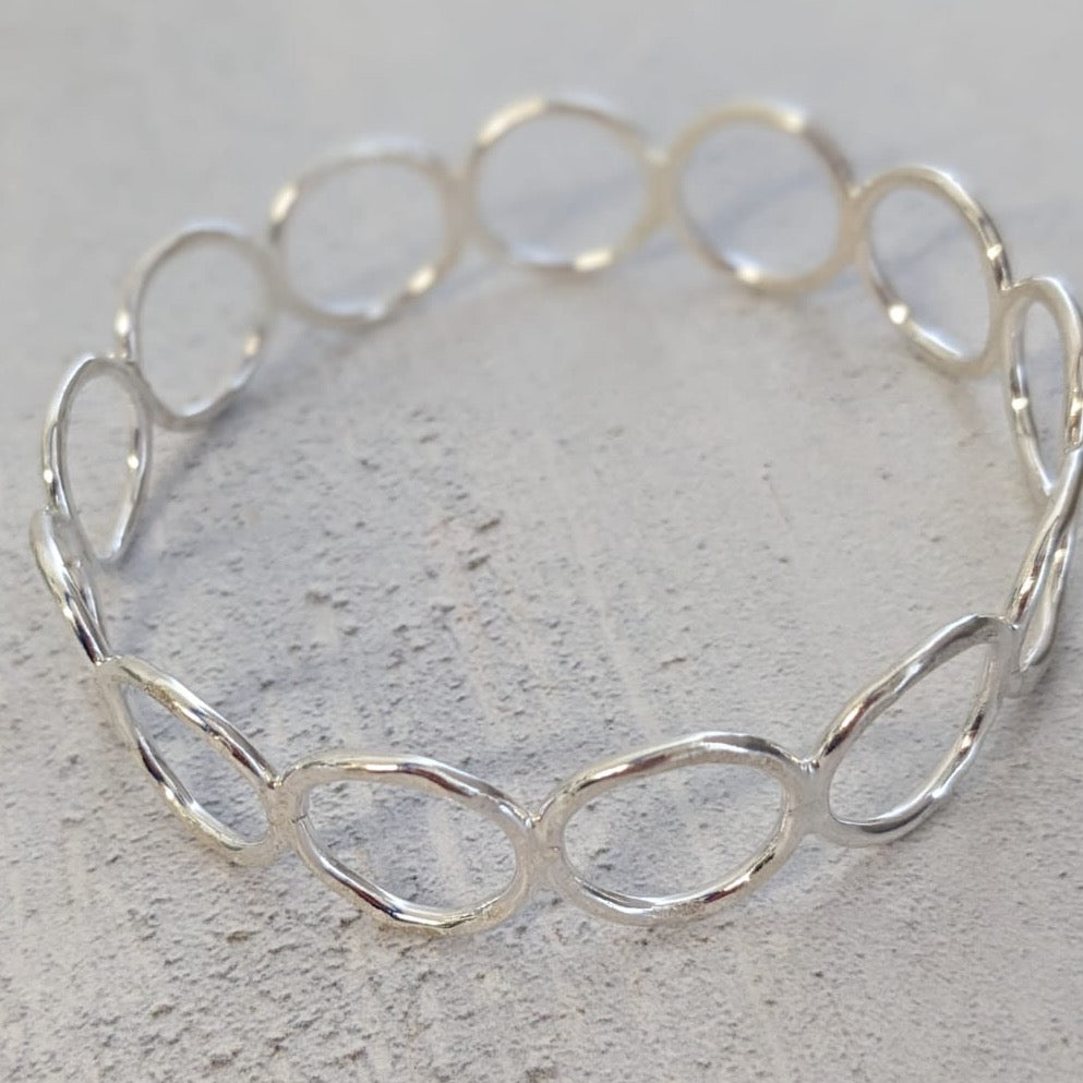 sterling silver handmade circles bangle online exclusive handmade by Lucy Kemp Jewellery comes in a choice of 3 sizes - limited numbers