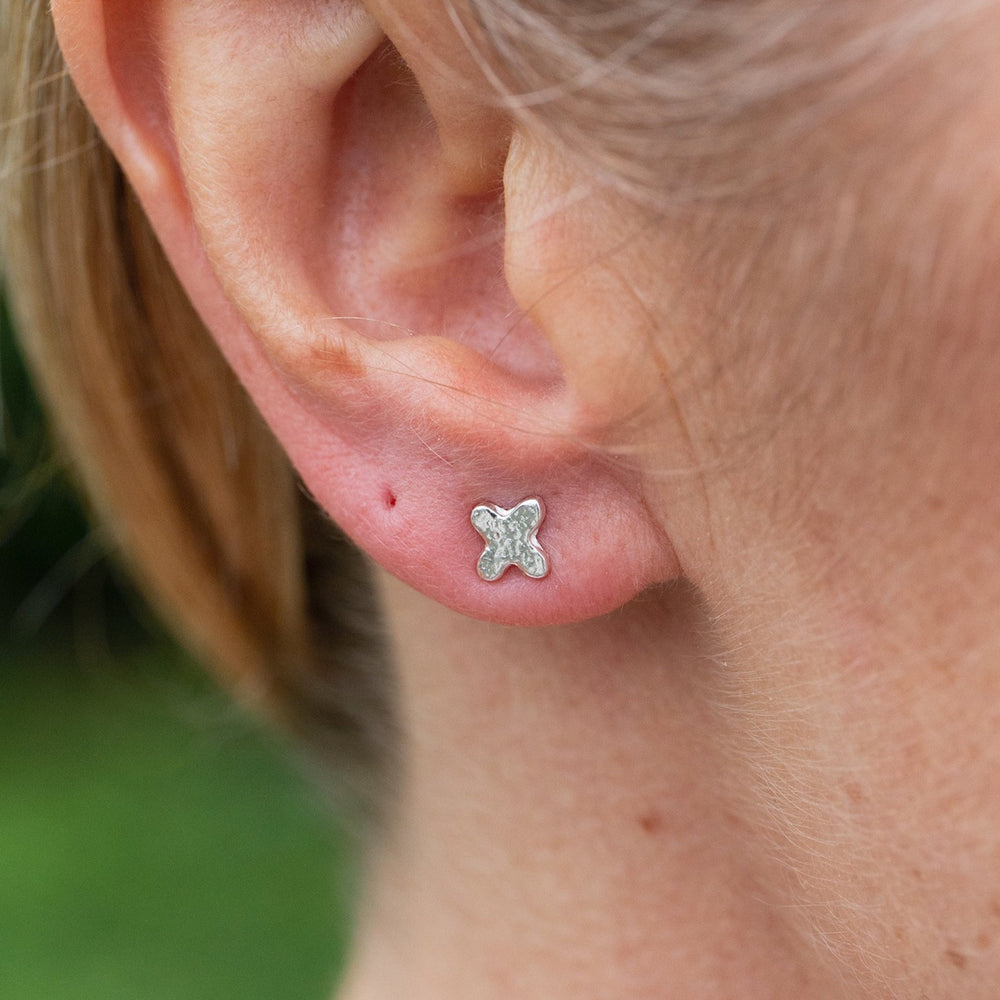 
                  
                    sterling silver textured mini hugs and kisses studs OX, Kiss worn, by Lucy Kemp Jewellery 
                  
                