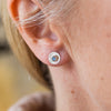 Worn Labradorite and sterling silver birthstone small disc studs by Lucy Kemp Jewellery