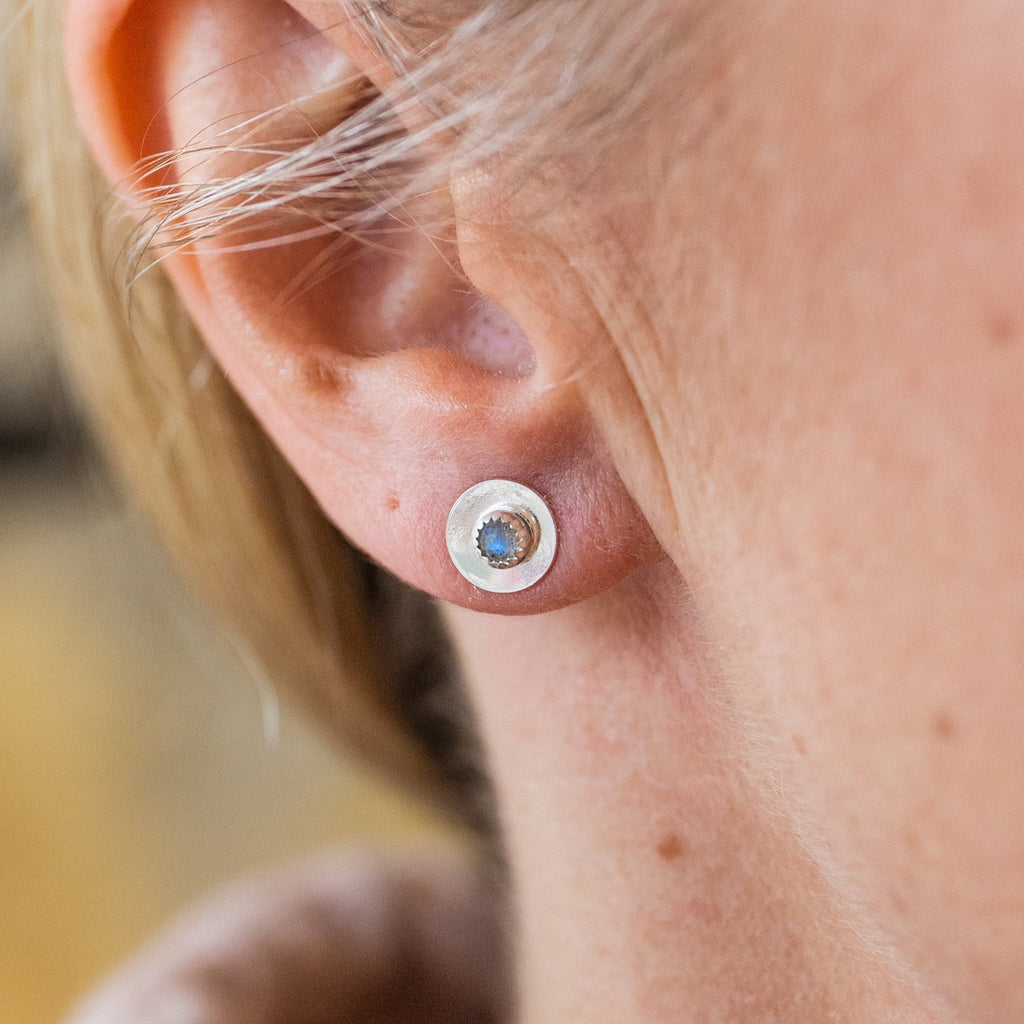 Worn Labradorite and sterling silver birthstone small disc studs by Lucy Kemp Jewellery